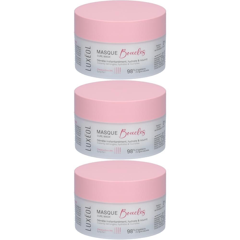 Trois pots avec couvercles roses. Inscription: LUXÉOL, Masque Boucles, 98% ingrédients d'origine naturelle.