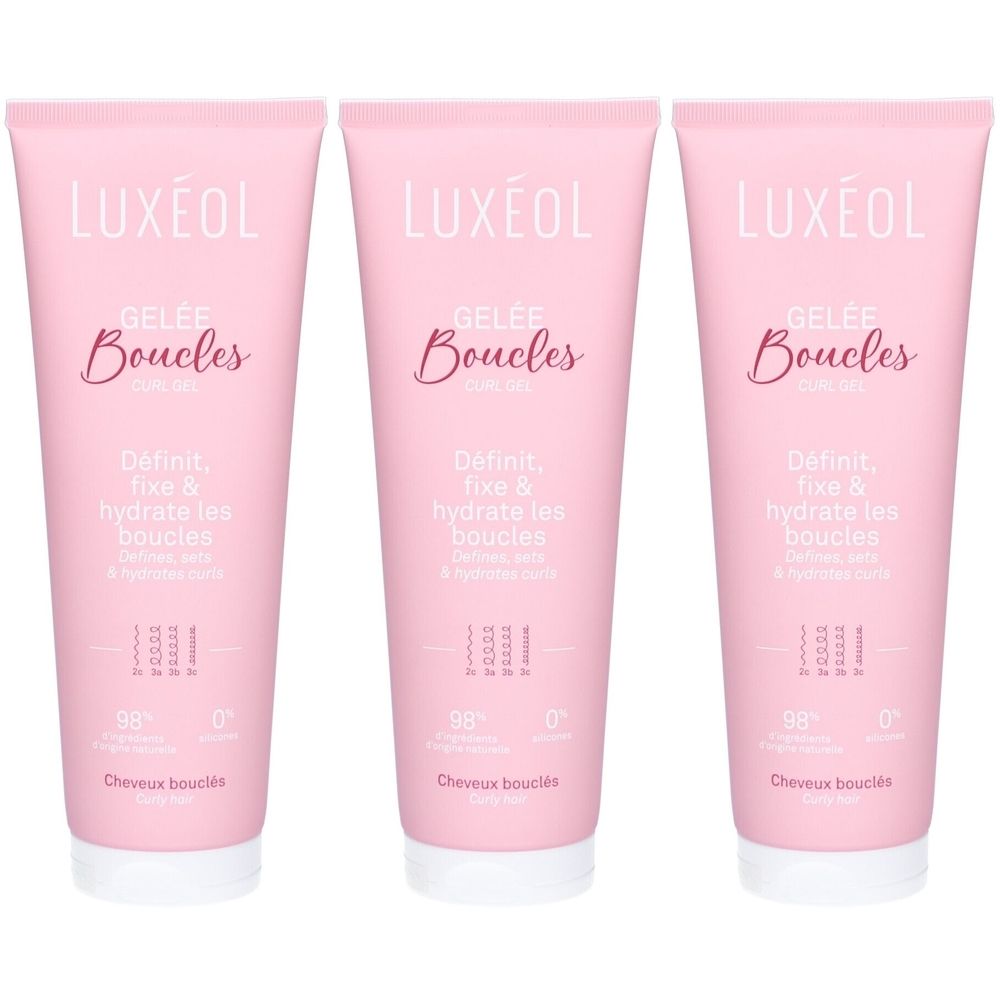 Drie roze tubes LUXÉOL Gelée Boucles. Opschrift: Gelée Boucles, Definieert, fixeert & hydrateert krullen. 98% ingrediënten van natuurlijke oorsprong.