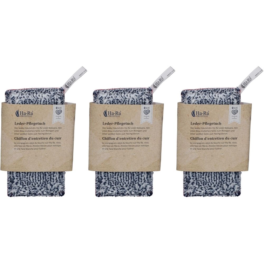 Trois chiffons d'entretien du cuir avec emballage. Chaque chiffon a un motif noir et blanc et est emballé dans une boîte en carton brun avec un logo.