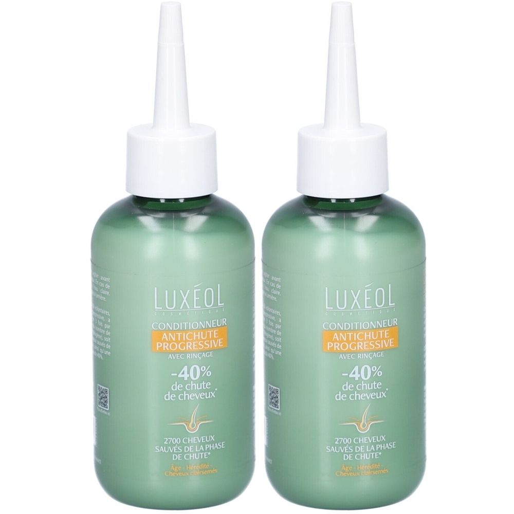Twee groene flessen met witte applicator. Opschrift: LUXÉOL, Conditioner Antichute Progressive, -40% de chute de cheveux.