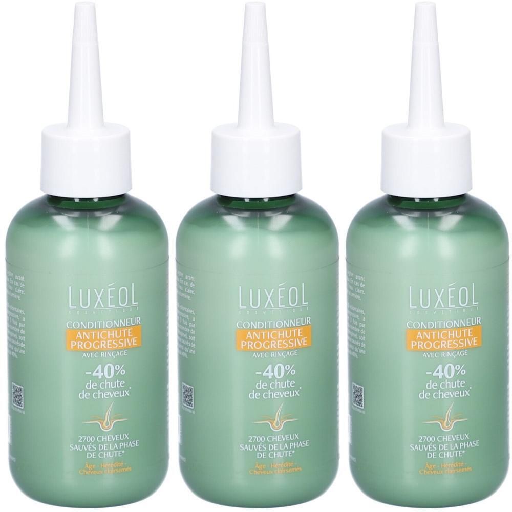 Drie groene flessen LUXÉOL Conditioner tegen haaruitval. Witte punt, gele strook met tekst. -40% de chute de cheveux.