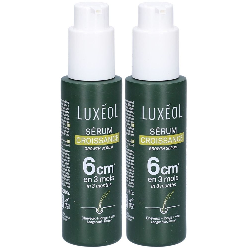 Twee groene flessen met witte pomp. Opschrift: LUXÉOL Sérum Croissance, 6 cm in 3 maanden. Voor langer haar.