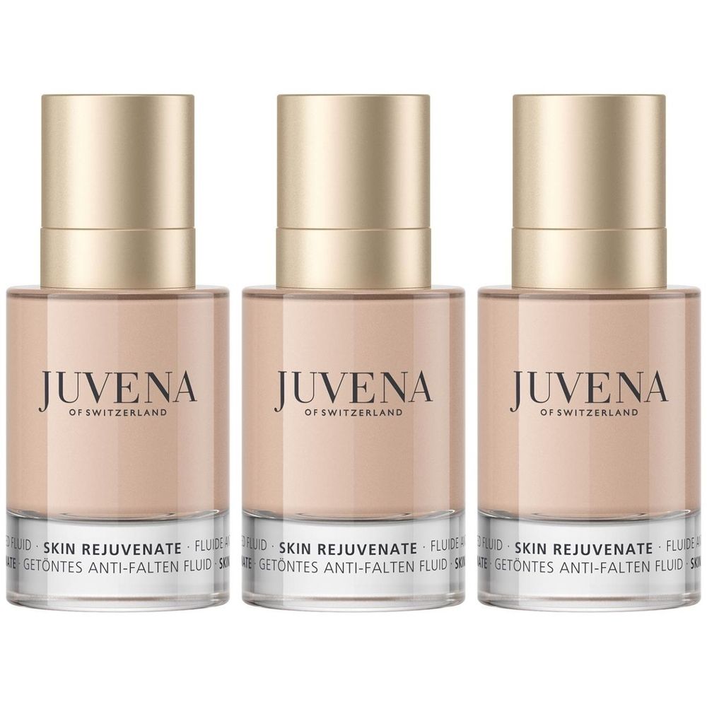 Drie flacons met beige inhoud en gouden doppen. Op de flacons staat "JUVENA OF SWITZERLAND" en "SKIN REJUVENATE FLUID".