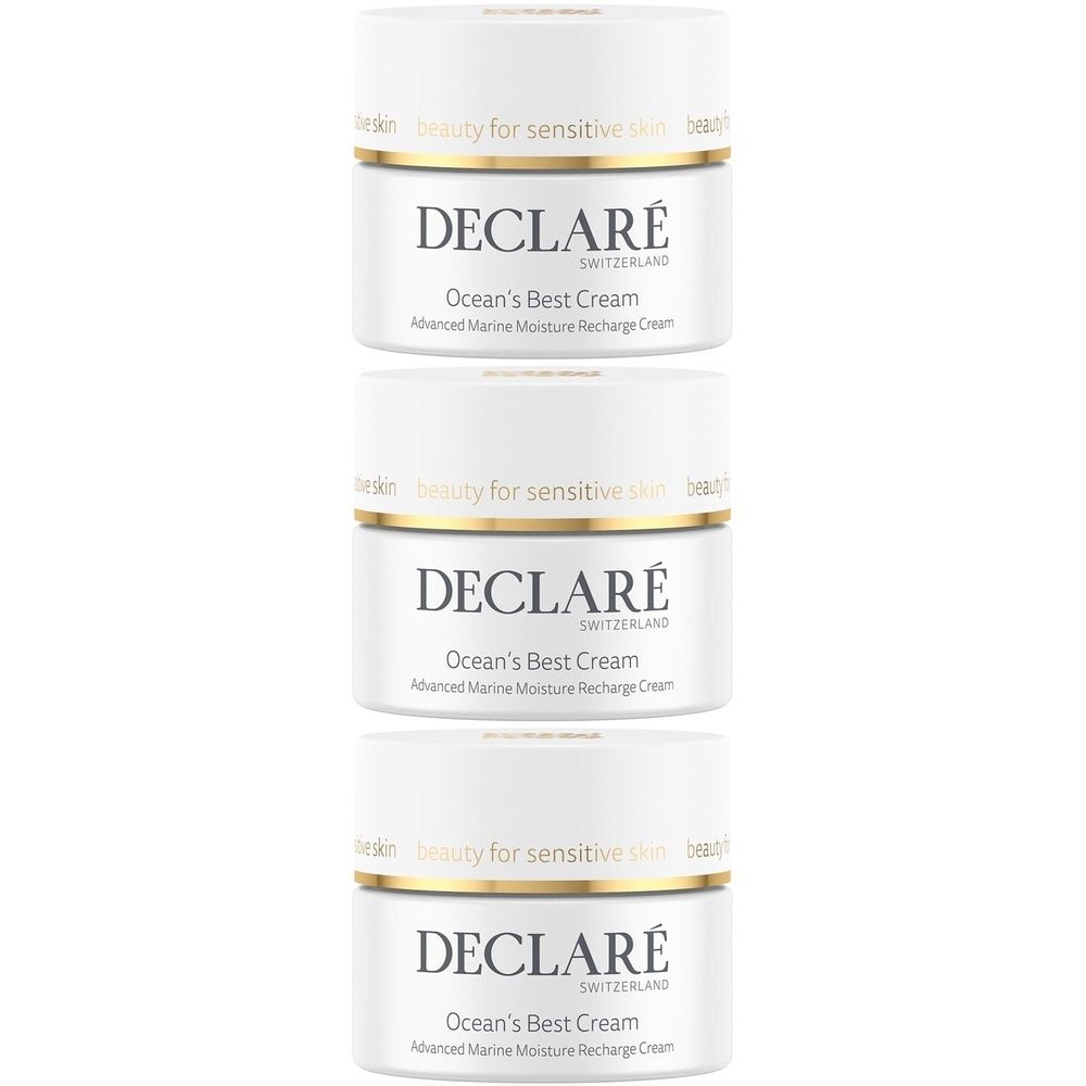 Trois pots blancs avec des bordures dorées. Chaque pot porte l'inscription "DECLARÉ Ocean's Best Cream".