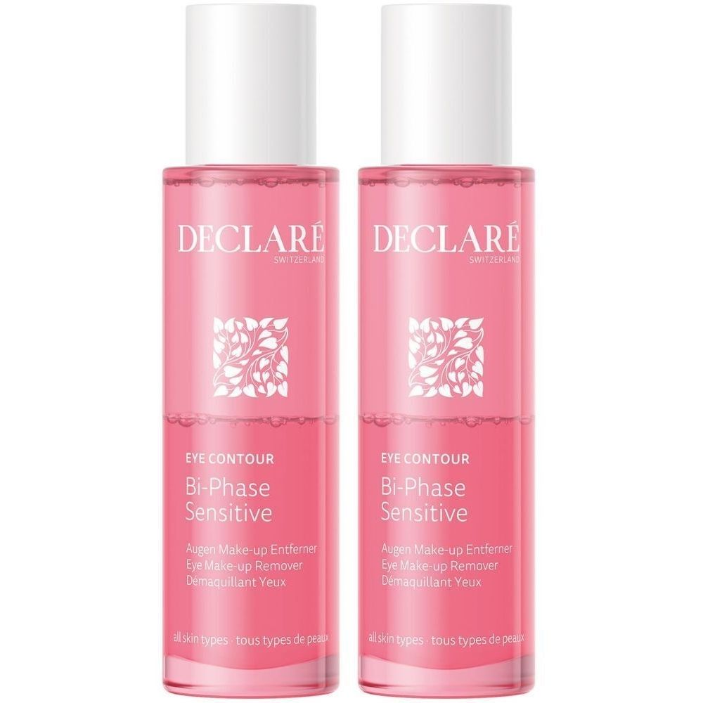 Twee flessen DECLARÉ Bi-Phase Sensitive oogmake-up remover. Roze vloeistof in transparante flessen met witte dop. Tekst op etiket.
