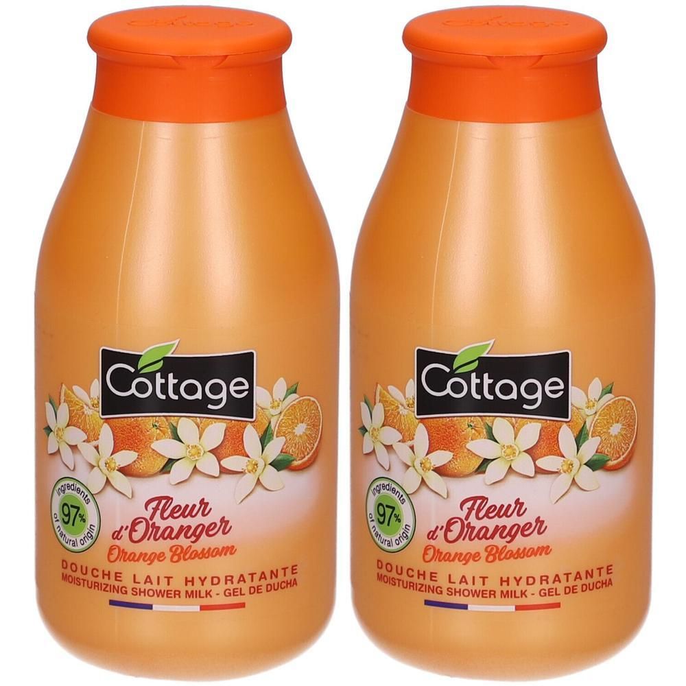 Deux flacons de douche hydratante. Flacons orange avec bouchons orange. Inscription: Cottage, Fleur d'Oranger, 97% ingrédients naturels.