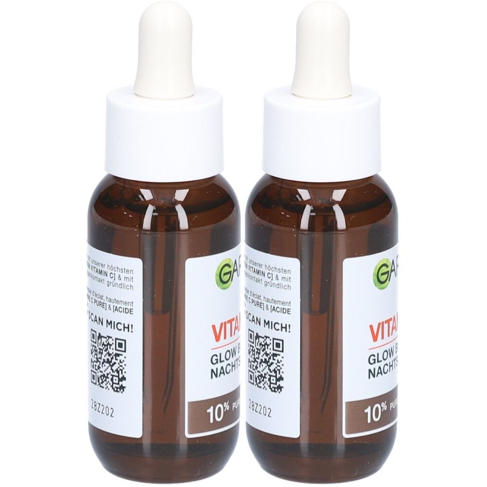 Twee bruine flessen met witte pipetten. De etiketten tonen "VITA GLOW NACHT" en "10%". Het logo is "GA".