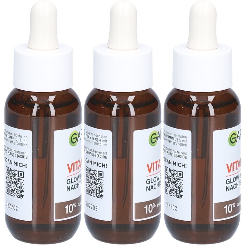 Drie bruine flessen met witte doppen en pipetten. De etiketten tonen "VITA GLOW NACHT" en "10% Pure". 