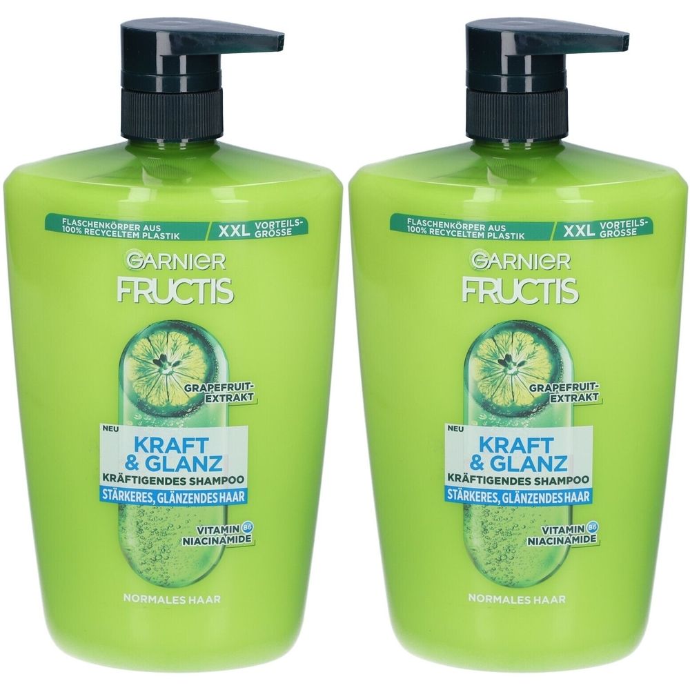 Deux flacons de shampooing verts avec bouchon pompe noir. Inscription : Garnier Fructis, Kraft & Glanz, extrait de pamplemousse.