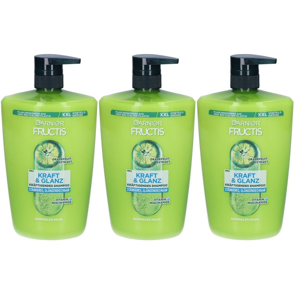 Trois flacons de shampooing verts avec pompe noire. Inscription : Garnier Fructis, Kraft & Glanz, Kräftigendes Shampoo.