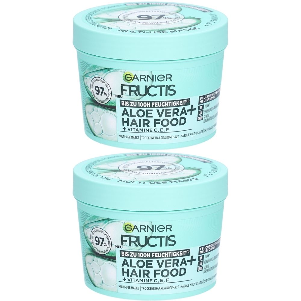 Deux pots turquoise avec couvercles. Inscription : Garnier Fructis Hair Food Aloe Vera+. Contient 97% d'ingrédients d'origine naturelle.