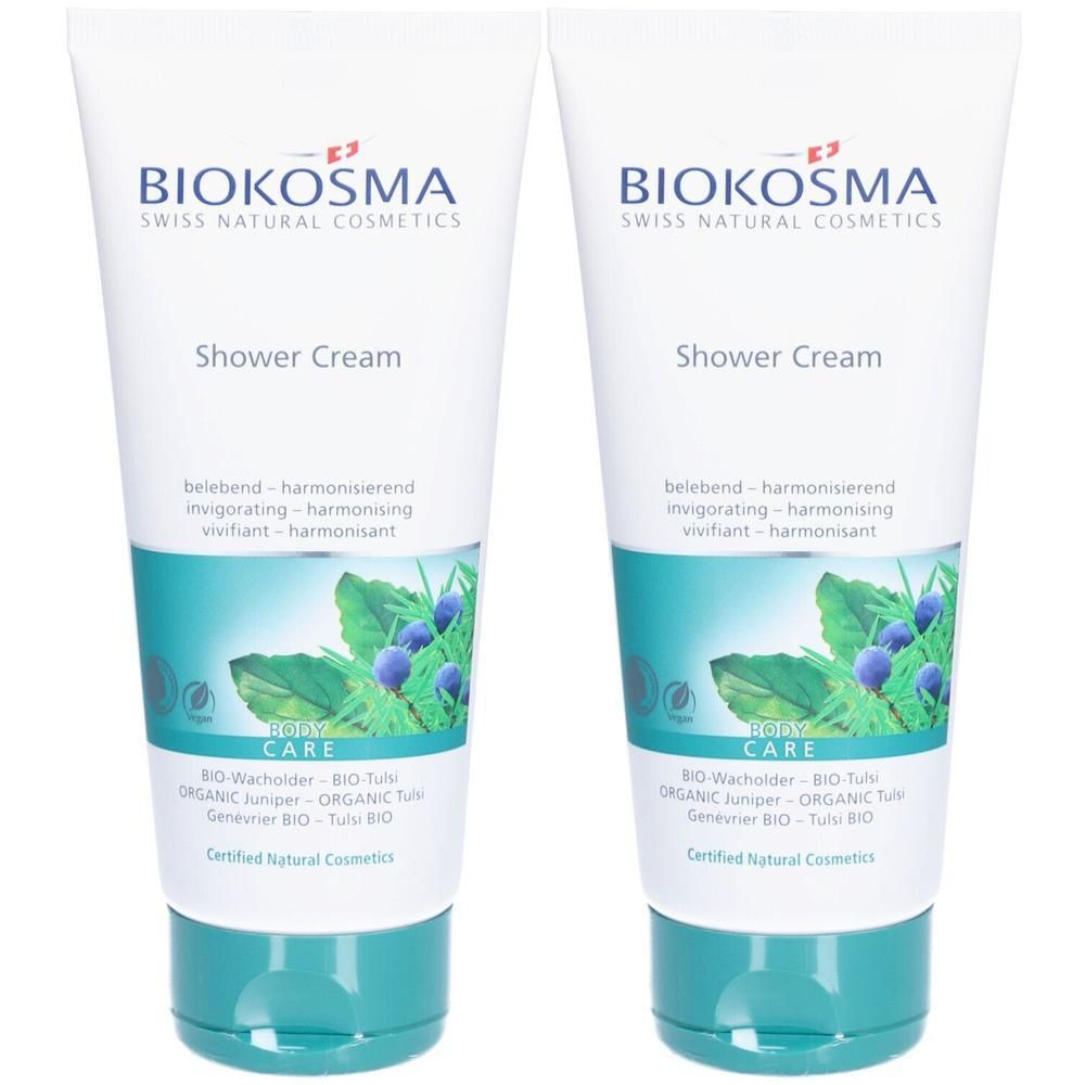 Twee tubes douchecrème. Wit, met blauwgroene accenten. Opschrift: Biokosma, Shower Cream, BIO-Wacholder & BIO-Tulsi.