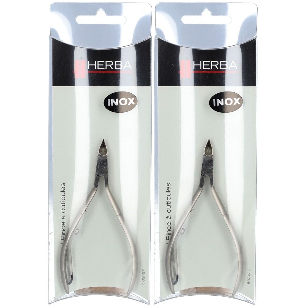 Deux pinces à cuticules HERBA en emballage blister. Inox. Inscription INOX. Pince à cuticules.