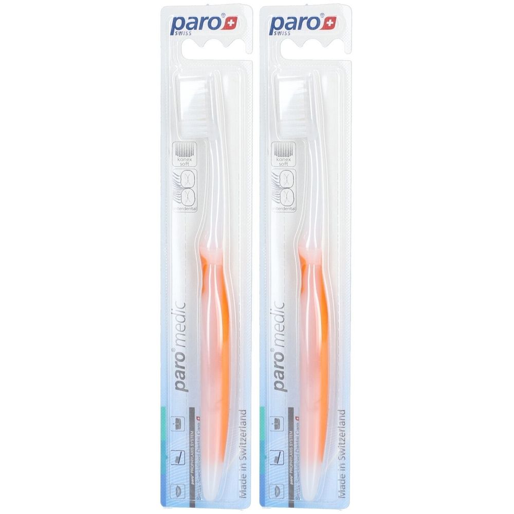 Deux brosses à dents dans un emballage transparent. Manche orange, tête blanche. Marque : paro medic.