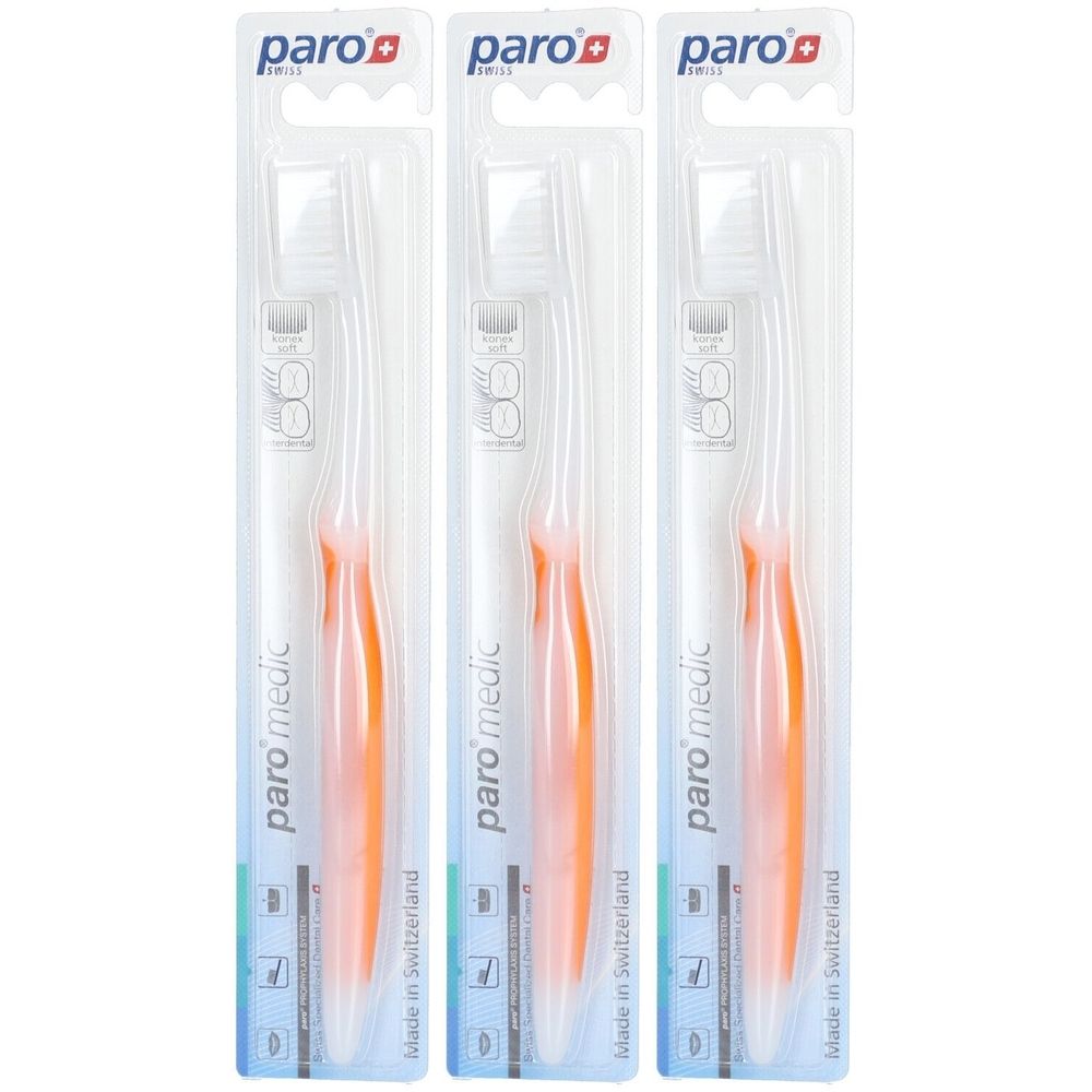 Trois brosses à dents emballées. Manches orange, soies transparentes. Marque : paro medic. Fabriqué en Suisse.