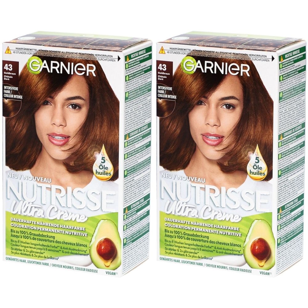 Twee dozen Garnier Nutrisse Ultra Crème haarkleuring. Nummer 43, goudkastanje. Afbeelding van een vrouw met bruin haar.