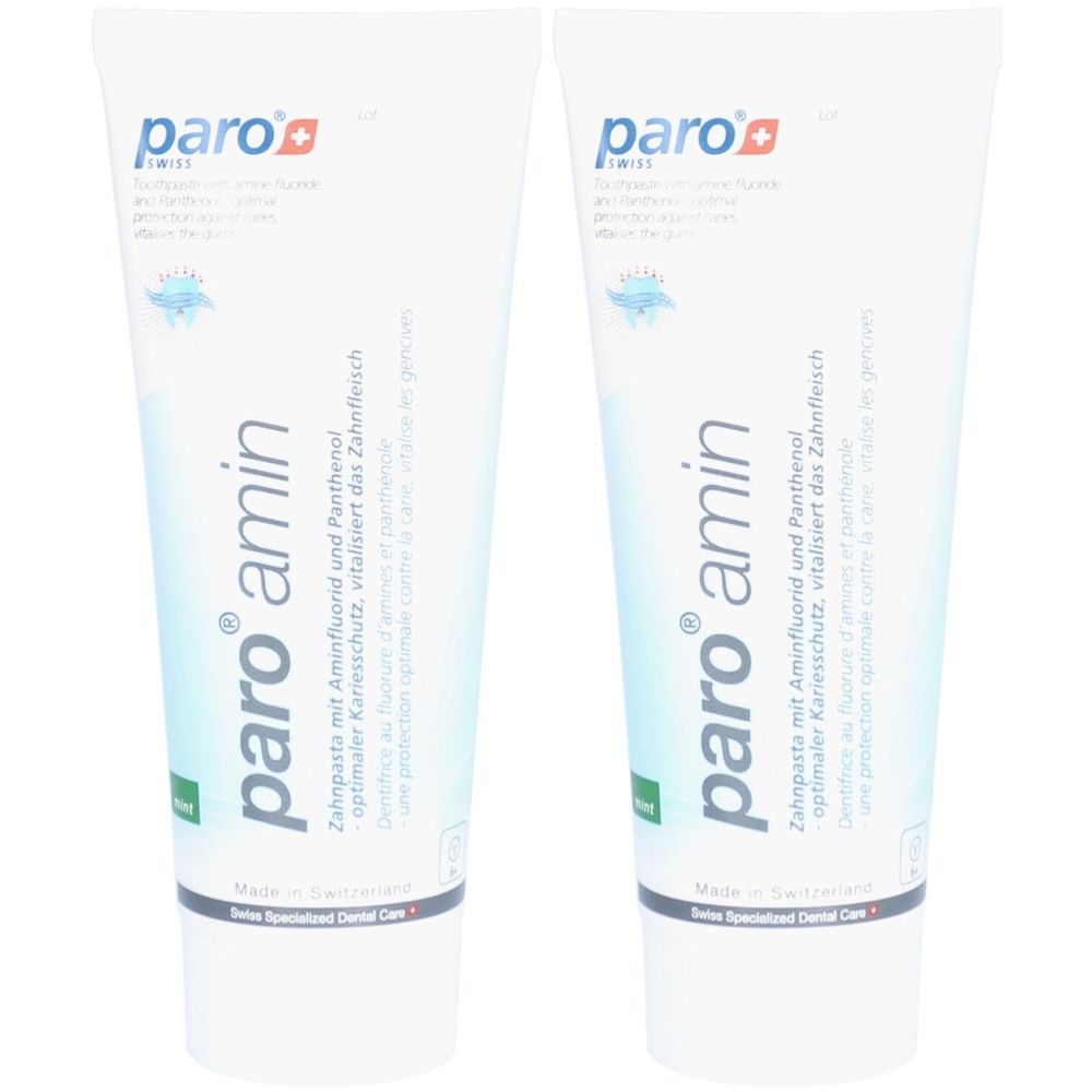 Twee tubes paro® amin tandpasta. Witte tubes met blauwe en groene tekst. Tekst: Tandpasta met aminefluoride en panthenol.