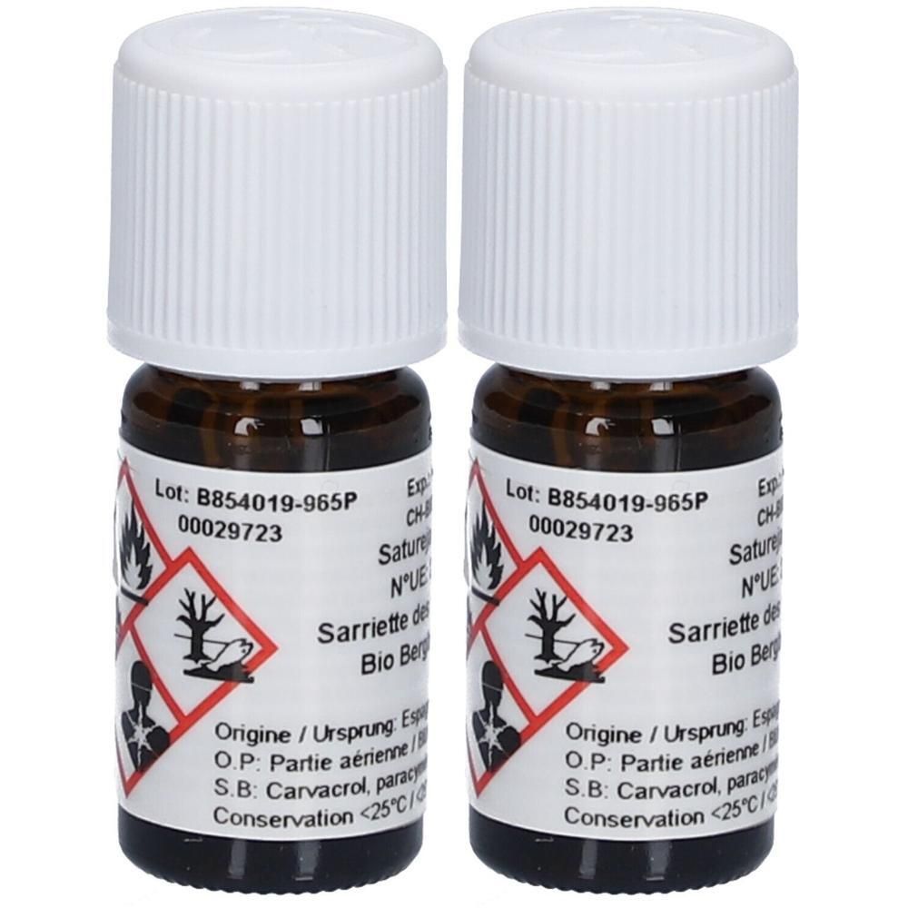 Deux petites bouteilles en verre brun avec bouchons blancs. Étiquettes avec texte et pictogrammes.