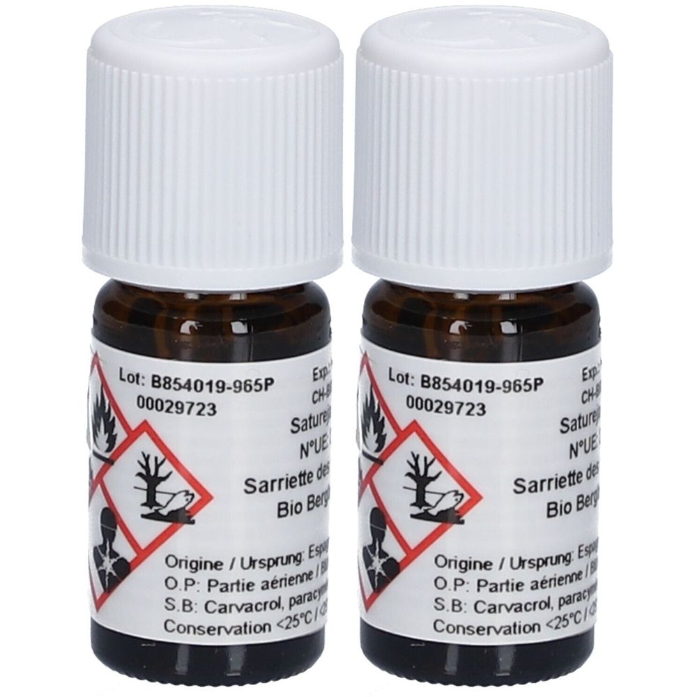 Deux petites bouteilles en verre brun avec bouchons blancs. Étiquettes avec texte et pictogrammes.