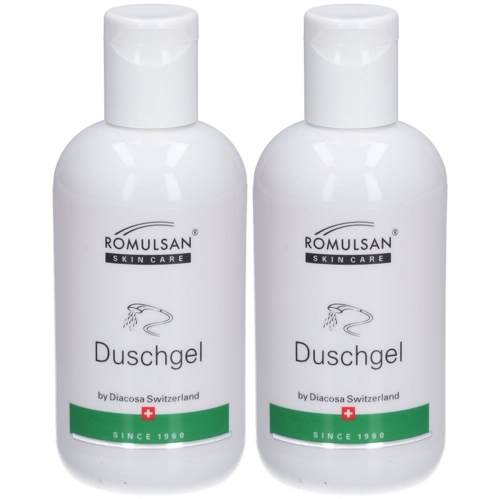 Twee witte flessen douchegel. Opschrift: ROMULSAN SKIN CARE, Duschgel, by Diacosa Switzerland, Zwitsers kruis, SINCE 1980.