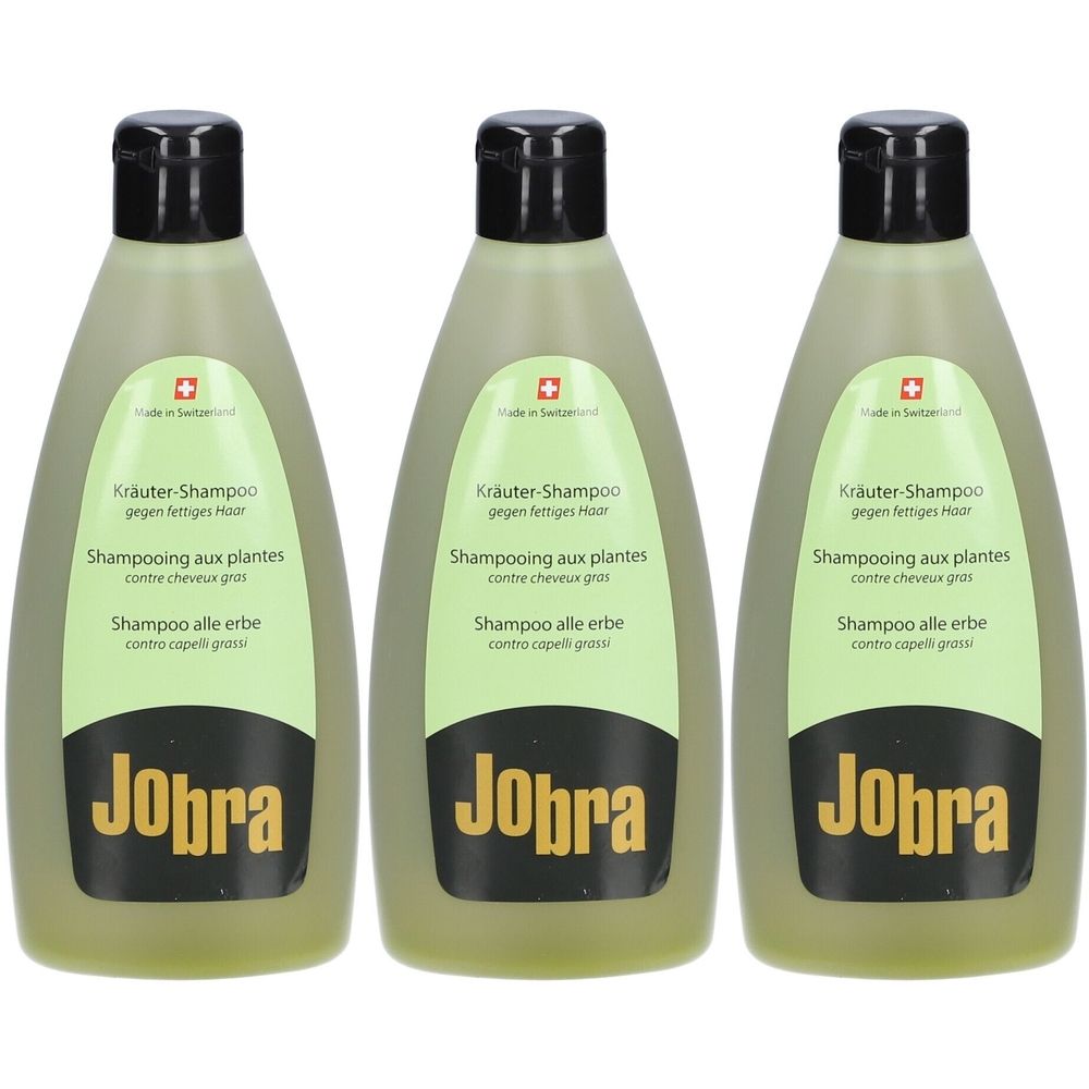 Drie groene shampoo flessen met zwarte dop. Opschrift: Jobra, Kräuter-Shampoo, Shampooing aux plantes, Shampoo alle erbe.