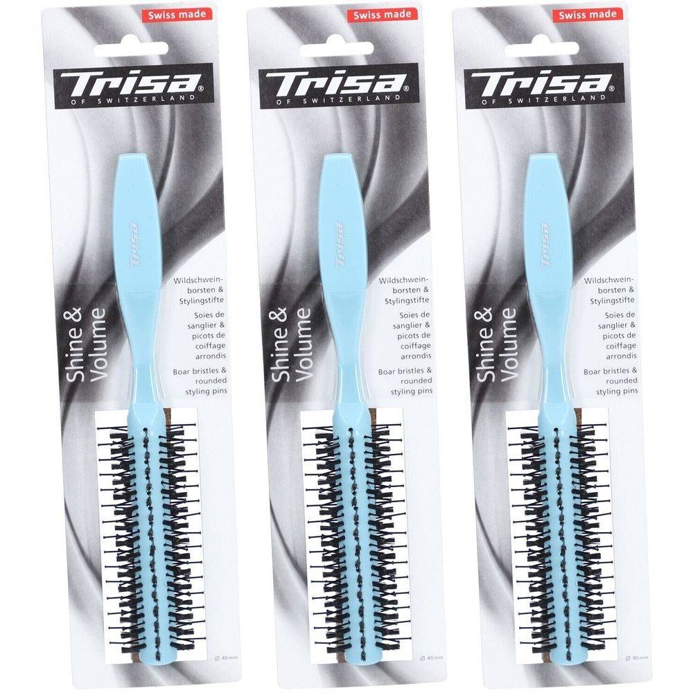 Drie stylingborstels in verpakking. Lichtblauw handvat, zwarte borstelharen. Opschrift: Trisa, Shine & Volume, Swiss made.