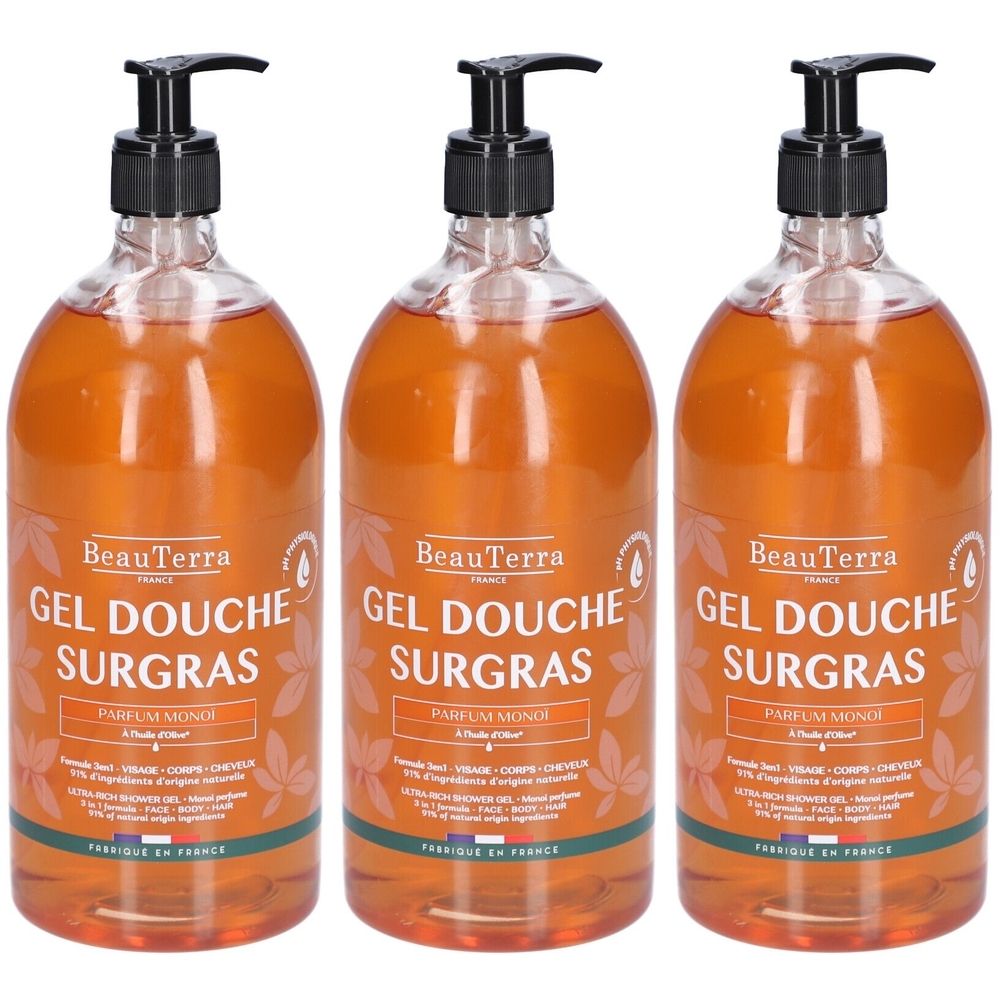 Trois flacons de gel douche avec pompe noire. Inscription: BeauTerra, Gel Douche Surgras, Parfum Monoï.