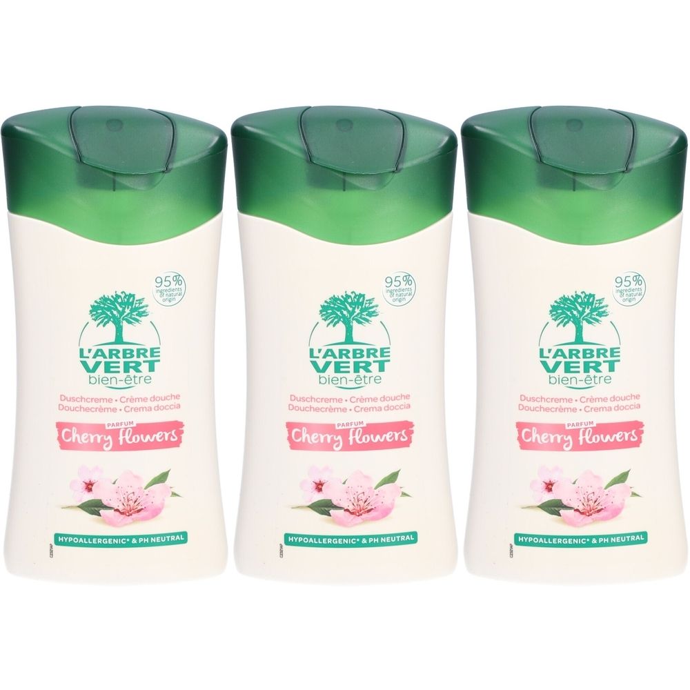 Trois flacons de crème de douche. Étiquette blanche, bouchon vert. Logo arbre. Texte : L'ARBRE VERT bien-être, Cherry Flowers. 95%.