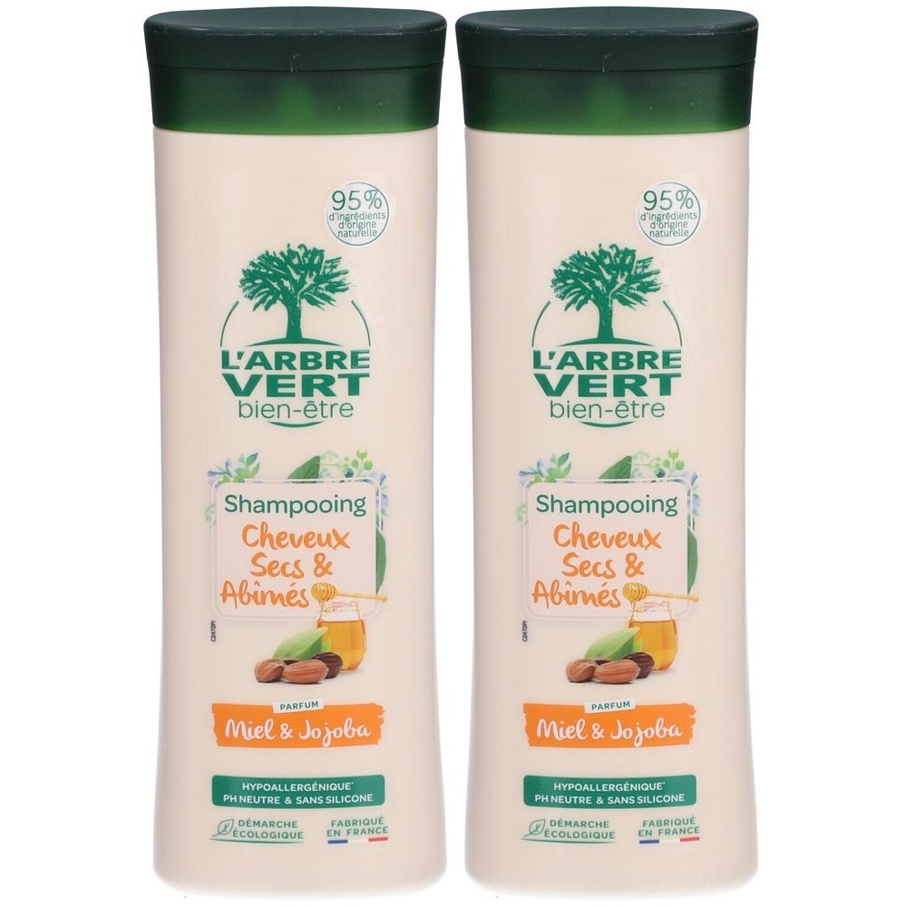 Twee shampoo flessen. Opschrift: L'ARBRE VERT, bien-être, Shampooing, Cheveux Secs & Abimés, Miel & Jojoba.