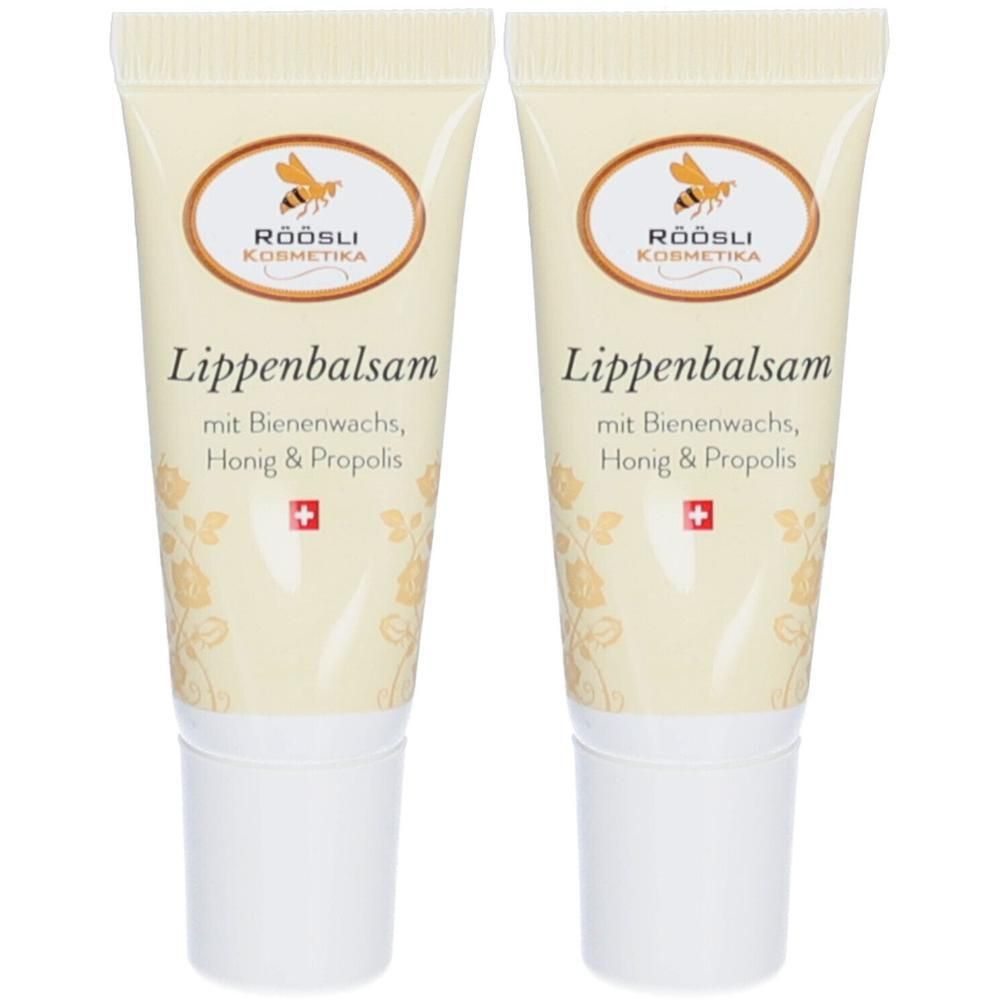Twee tubes lippenbalsem. Beige tubes met witte dop. Logo en tekst "Lippenbalsam" zichtbaar.