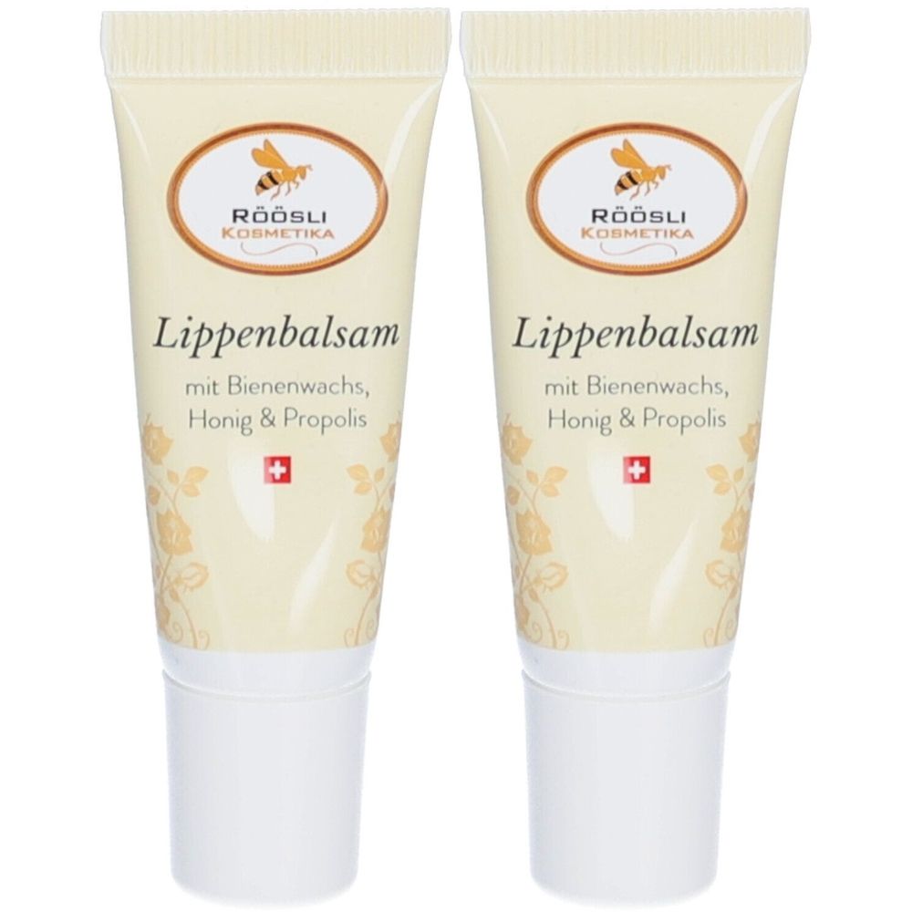 Twee tubes lippenbalsem. Beige tubes met witte dop. Logo en tekst "Lippenbalsam" zichtbaar.
