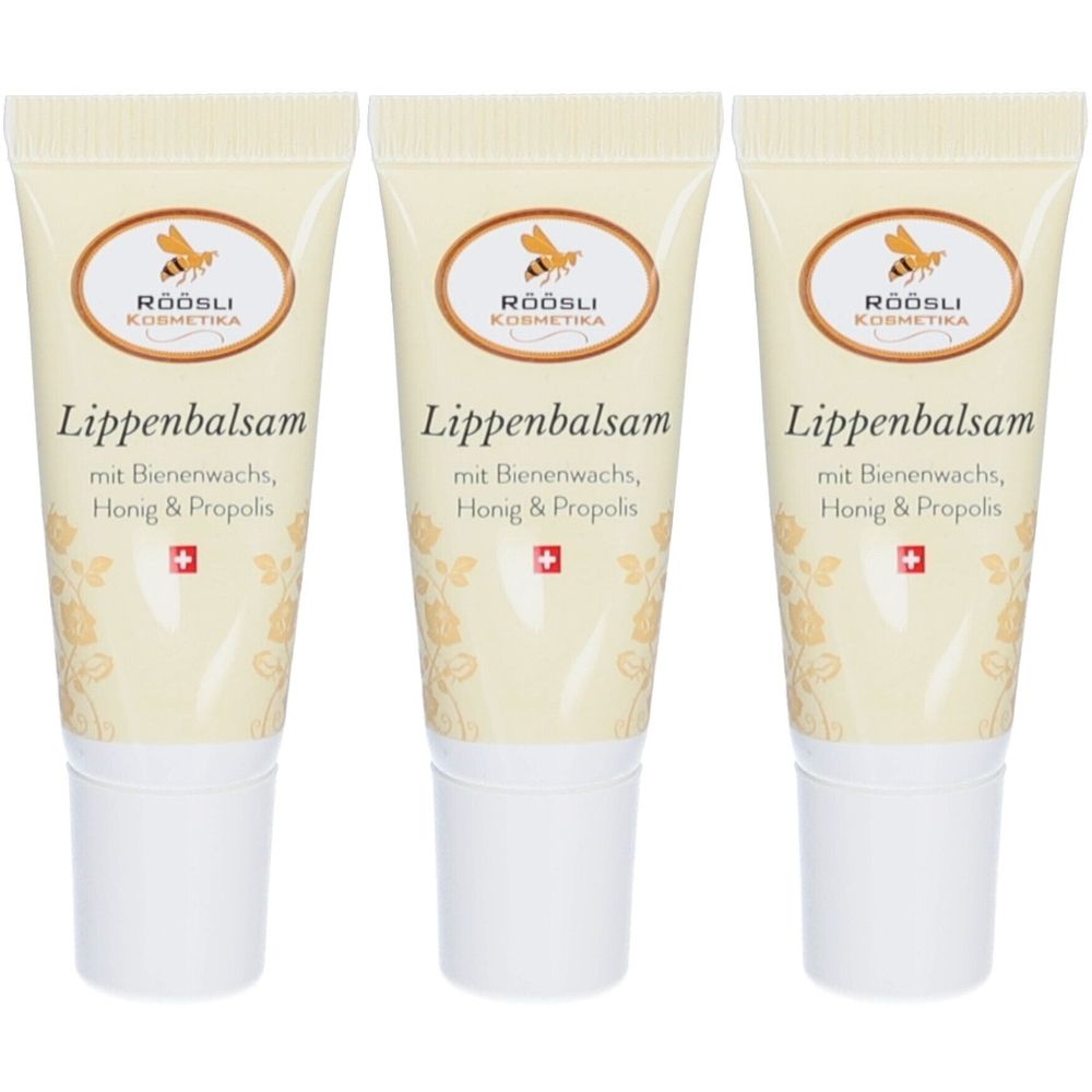 Drie tubes lippenbalsem. Elke tube heeft "RÖÖSLI Kosmetika" en "Lippenbalsam mit Bienenwachs, Honig & Propolis". Zwitsers kruis.