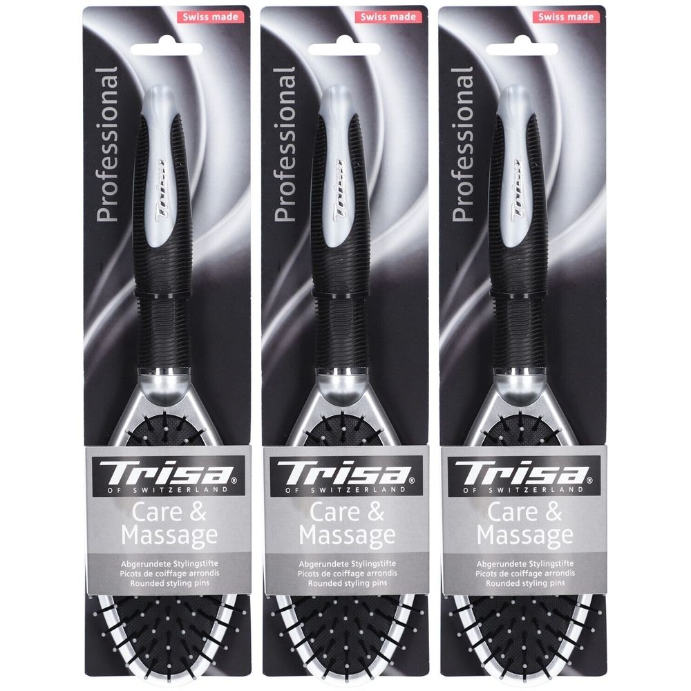 Drie haarborstels in verpakking. Zwarte handgreep, zilveren borstelkop, tekst: Trisa Care & Massage, Swiss Made.