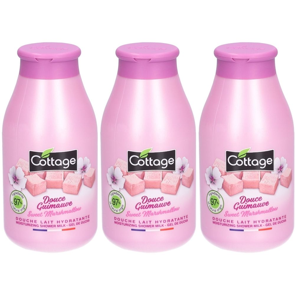 Drie roze flessen. Op elke fles staat "Cottage Douche Lait Hydratante Douce Guimauve".