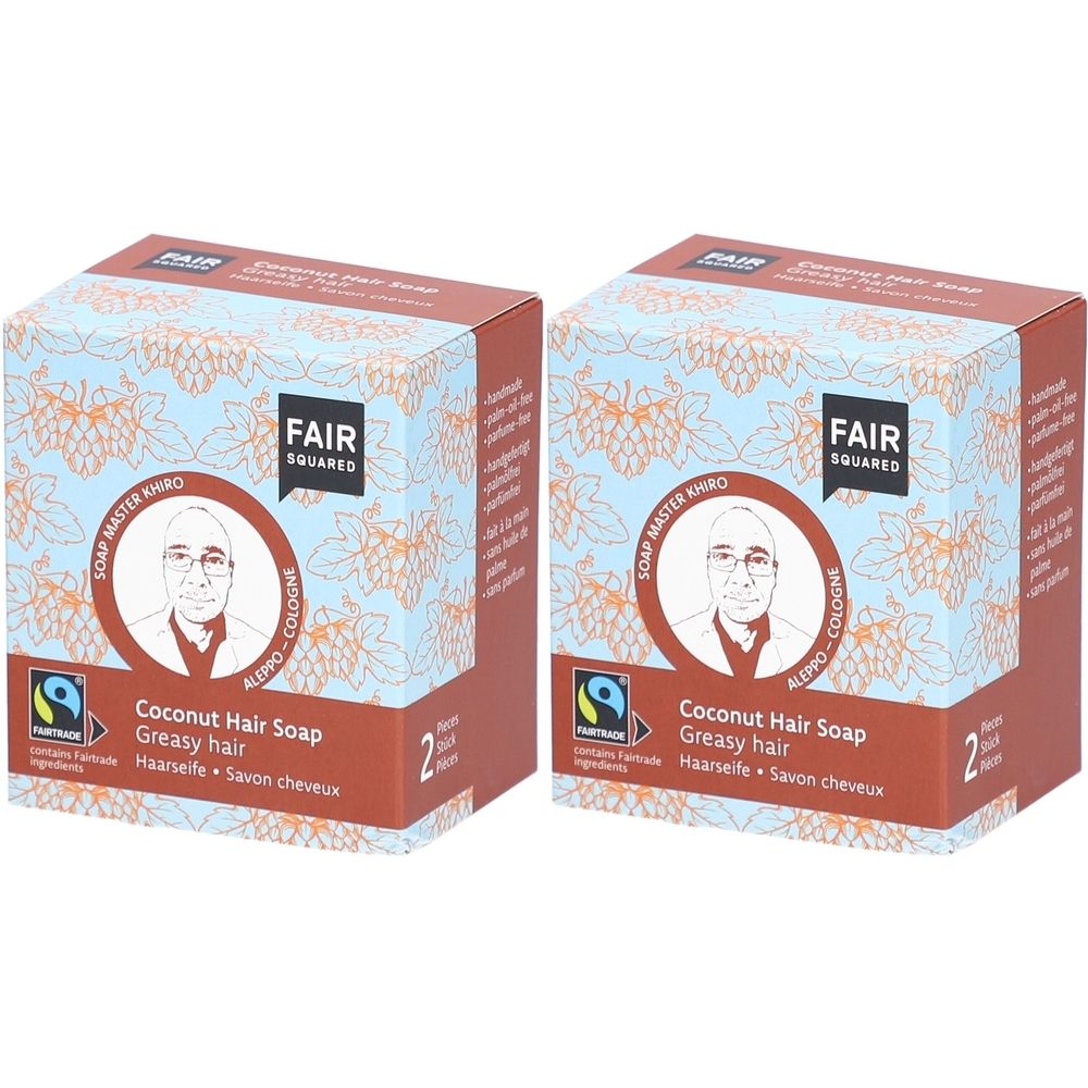 Twee vierkante dozen met FAIR SQUARED-logo en productinformatie. Opschrift: Coconut Hair Soap, voor vet haar.