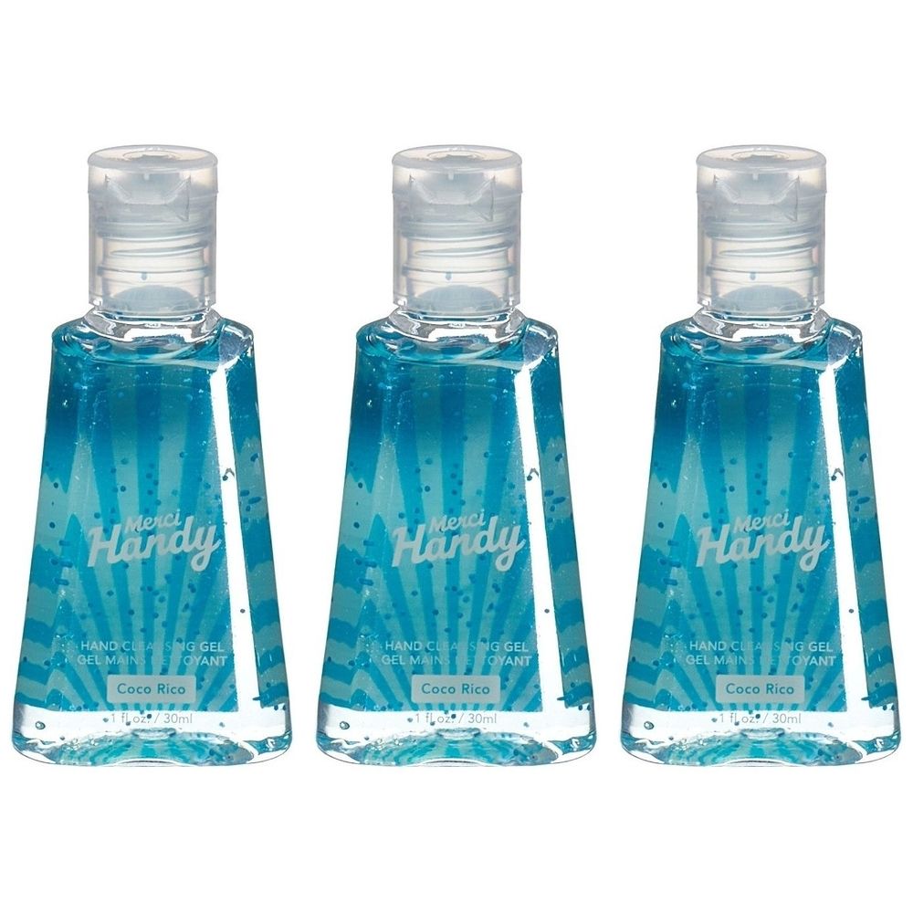 Drie flacons blauwe gel. Op elke fles staat "Merci Handy" en "Coco Rico". Transparante flacons met klapdeksel.