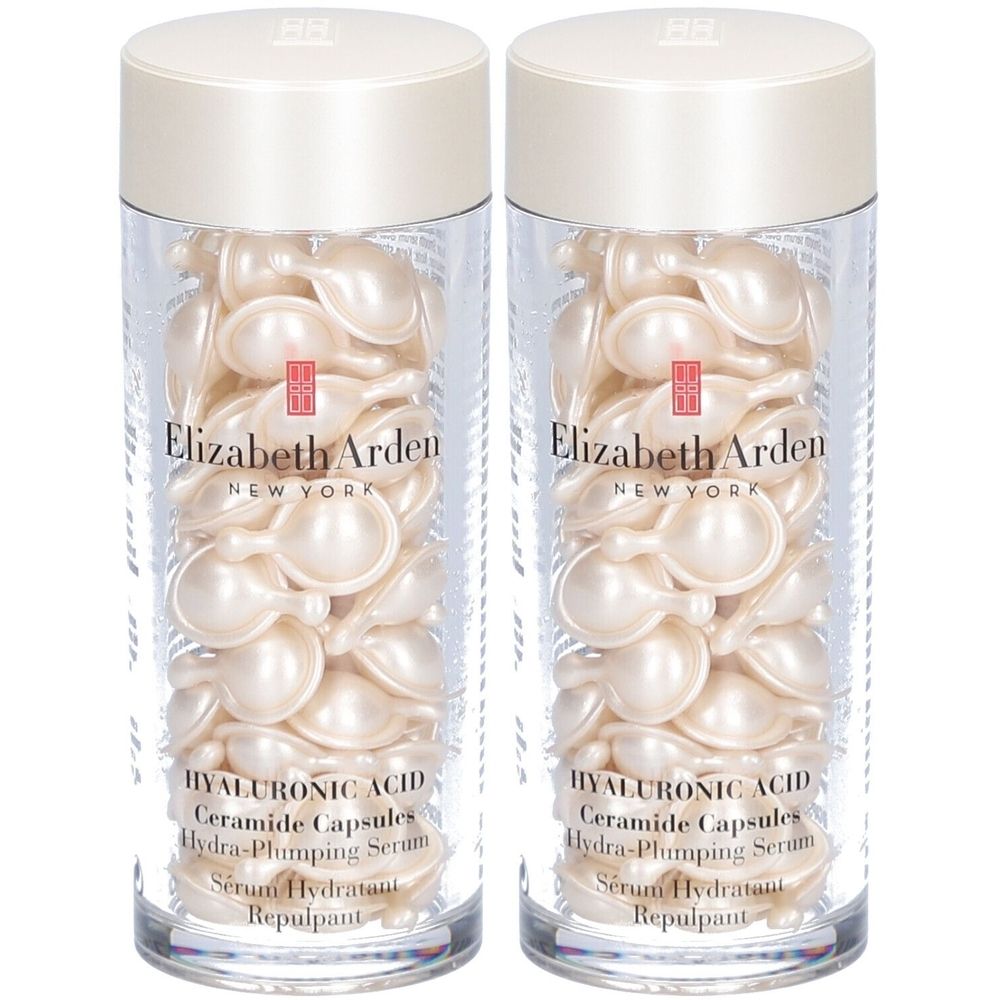 Deux flacons transparents remplis de capsules ovales crème. Inscription: Elizabeth Arden, Hyaluronic Acid Ceramide Capsules Hydra-Plumping Serum.
