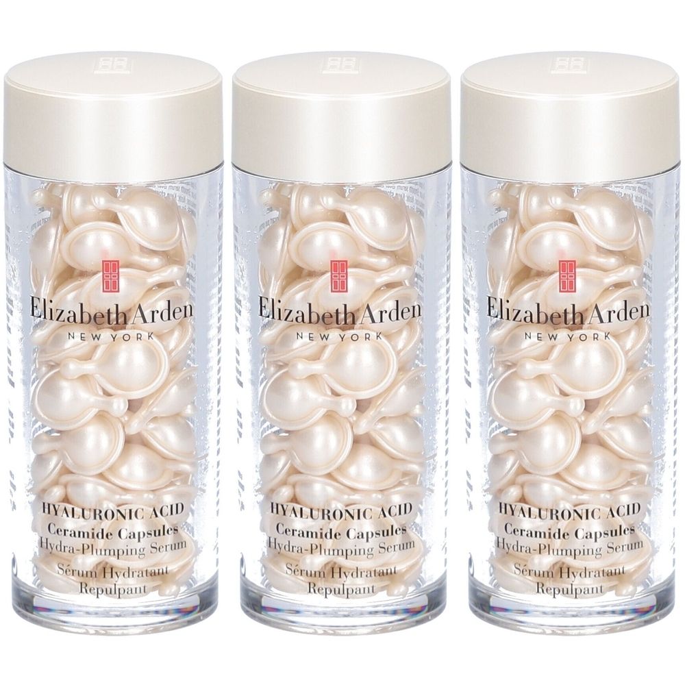 Trois flacons de capsules de sérum. Chaque flacon contient des capsules ovales crème. "Elizabeth Arden, New York" est écrit sur chaque flacon.