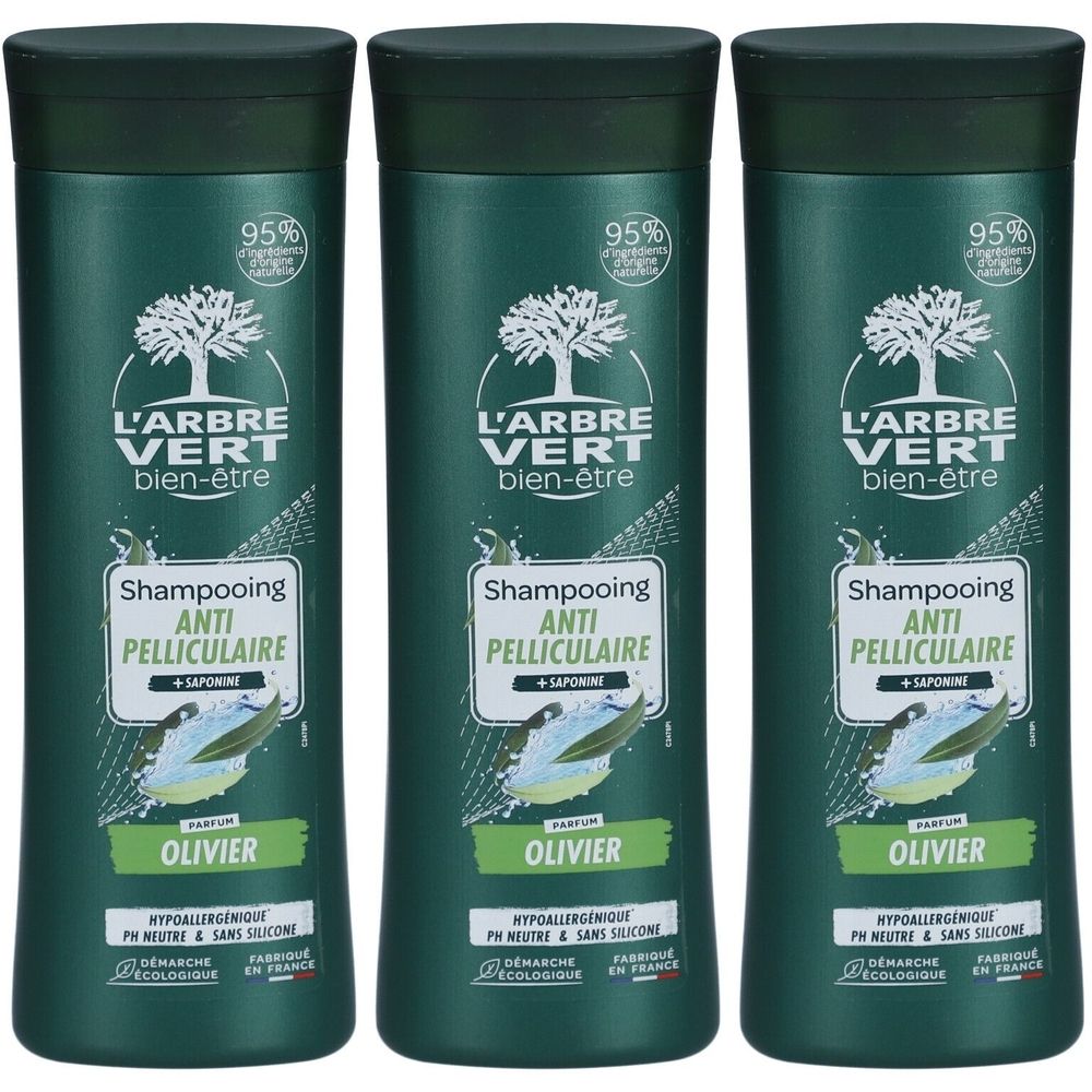Drie groene shampoo flessen. Opschrift: L'ARBRE VERT bien-être, Shampooing Anti-Pelliculaire, OLIVIER. 95% ingrediënten van natuurlijke oorsprong.