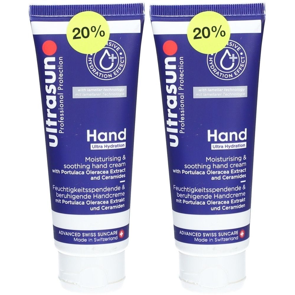 Twee blauwe tubes handcrème. Opschrift: Ultrasun, Hand Ultra Hydration. Met 20% korting sticker.