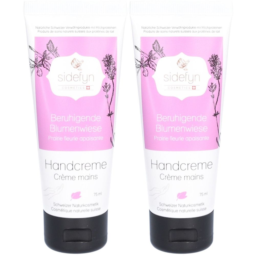 Twee tubes handcrème. Roze-wit ontwerp met bloemenillustraties en tekst: "Beruhigende Blumenwiese", "Handcreme", "sidefyn". Zwarte doppen.
