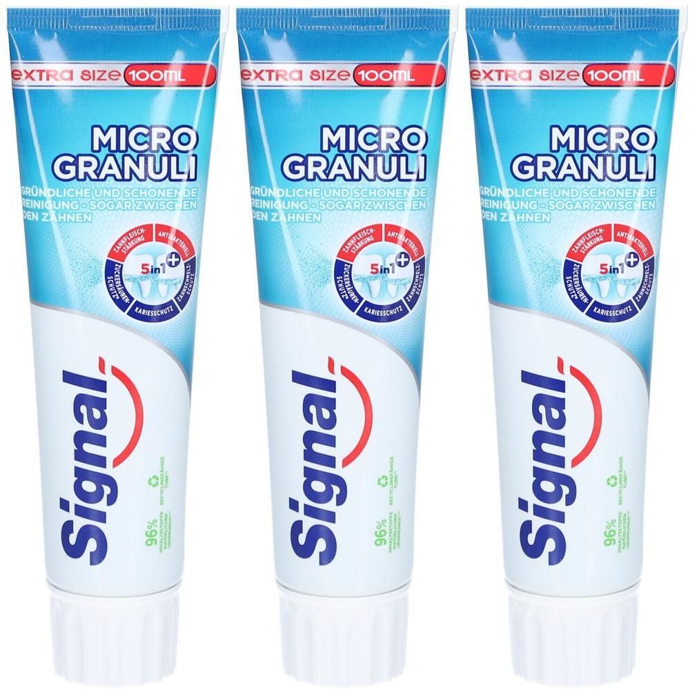 Drie tubes Signal Micro Granuli tandpasta. Blauw-witte verpakking met productnaam en logo. Extra Size 100ml.