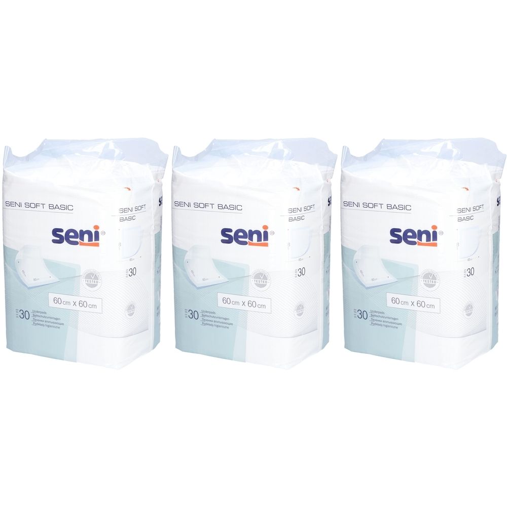 Drie verpakkingen Seni Soft Basic onderleggers. Elke verpakking bevat 30 stuks, 60x60cm. Het Seni logo is zichtbaar.