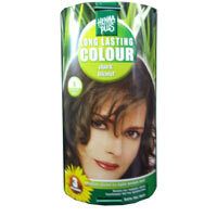Cilindrische verpakking met vrouwengezicht en productnaam. Groen-geel ontwerp. Opschrift: Long Lasting Colour, Dunkelblond.