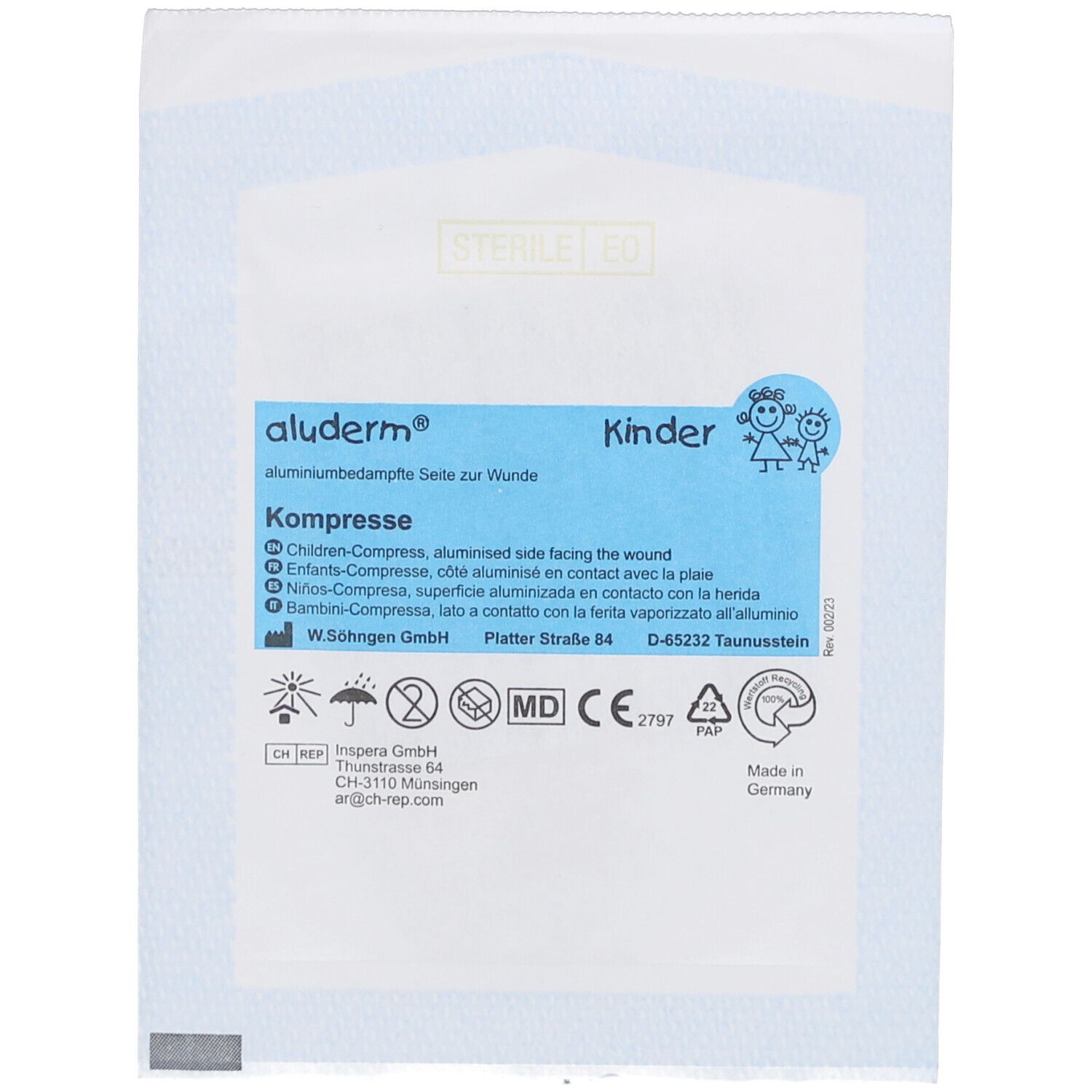 Kompres aluderm® Kinder, blauwe verpakking. Tekst: Kinder, aluminiumzijde voor de wond. Logo's en adres.