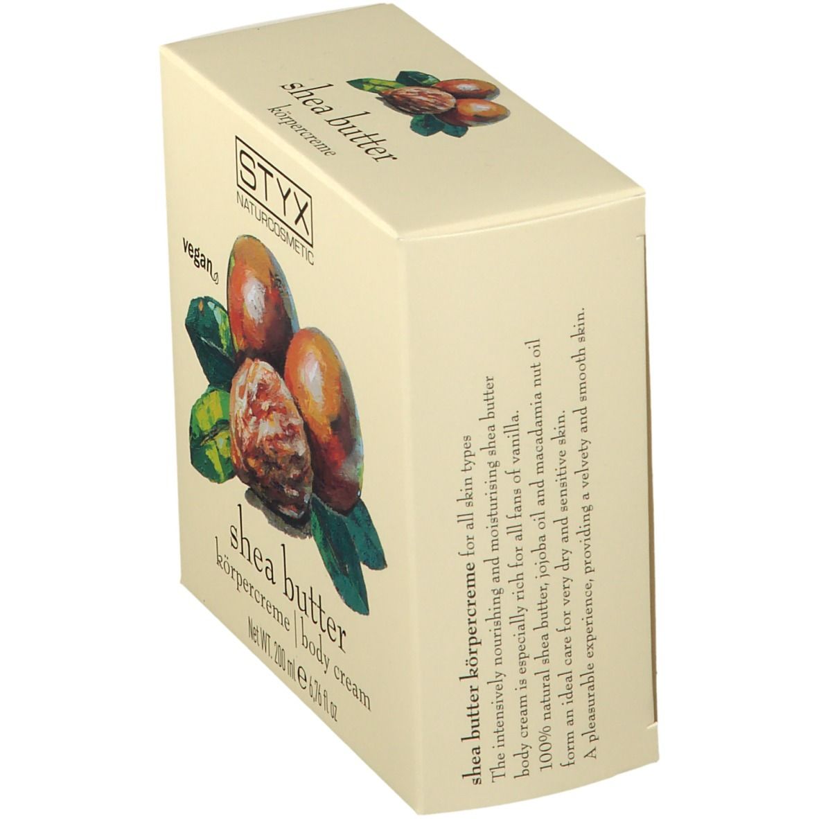 Crèmepot met deksel. Op deksel: STYX, sheabutter bodycrème. Afbeelding van sheanoten en bladeren.
