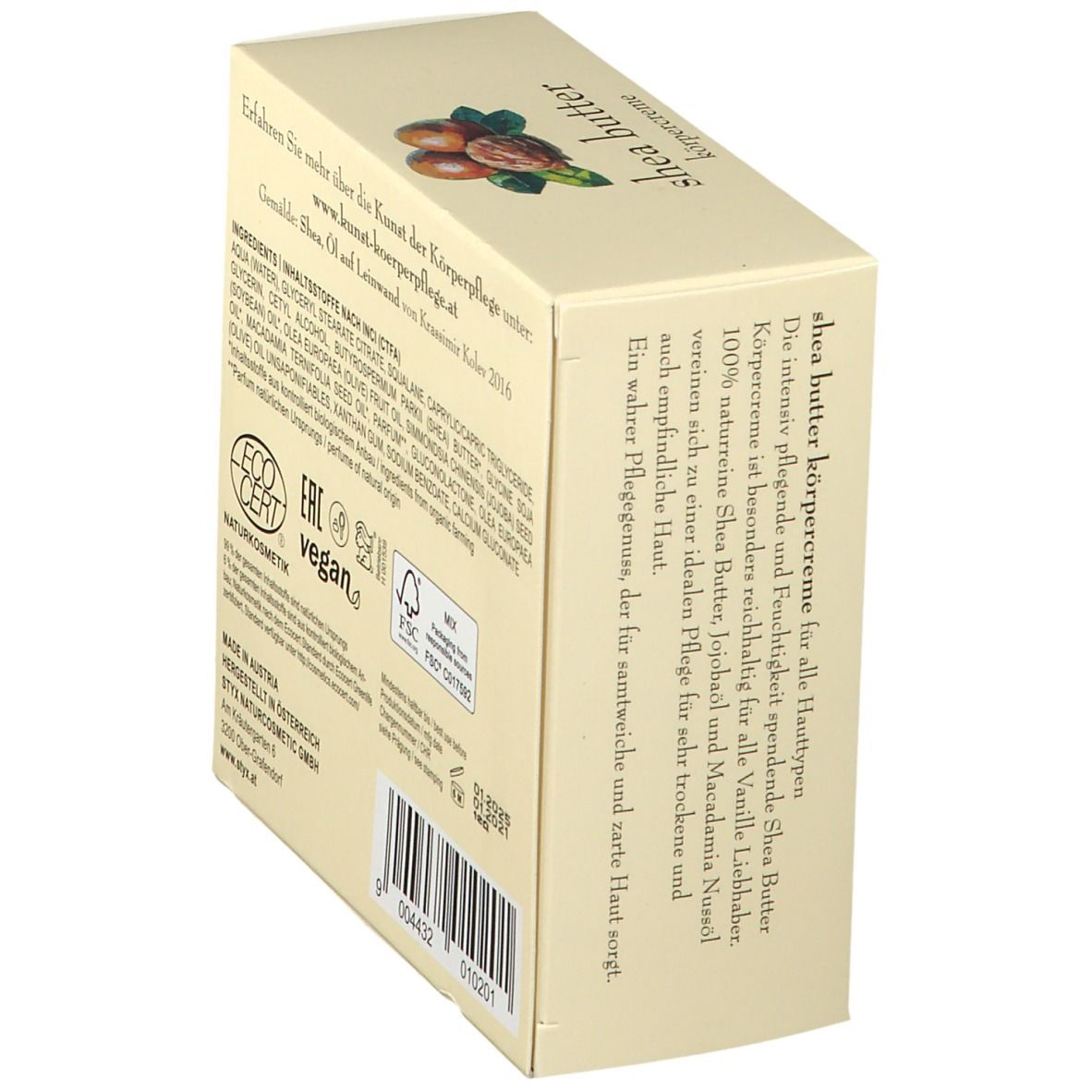 Crèmepot met deksel. Op deksel: STYX, sheabutter bodycrème. Afbeelding van sheanoten en bladeren.