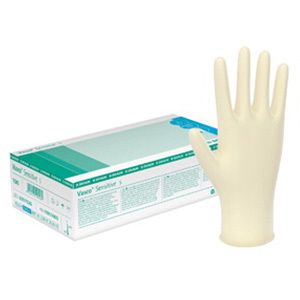 Gant taille 6-7 à côté d'un emballage. Emballage avec l'inscription Vasco® Sensitive, sans poudre.