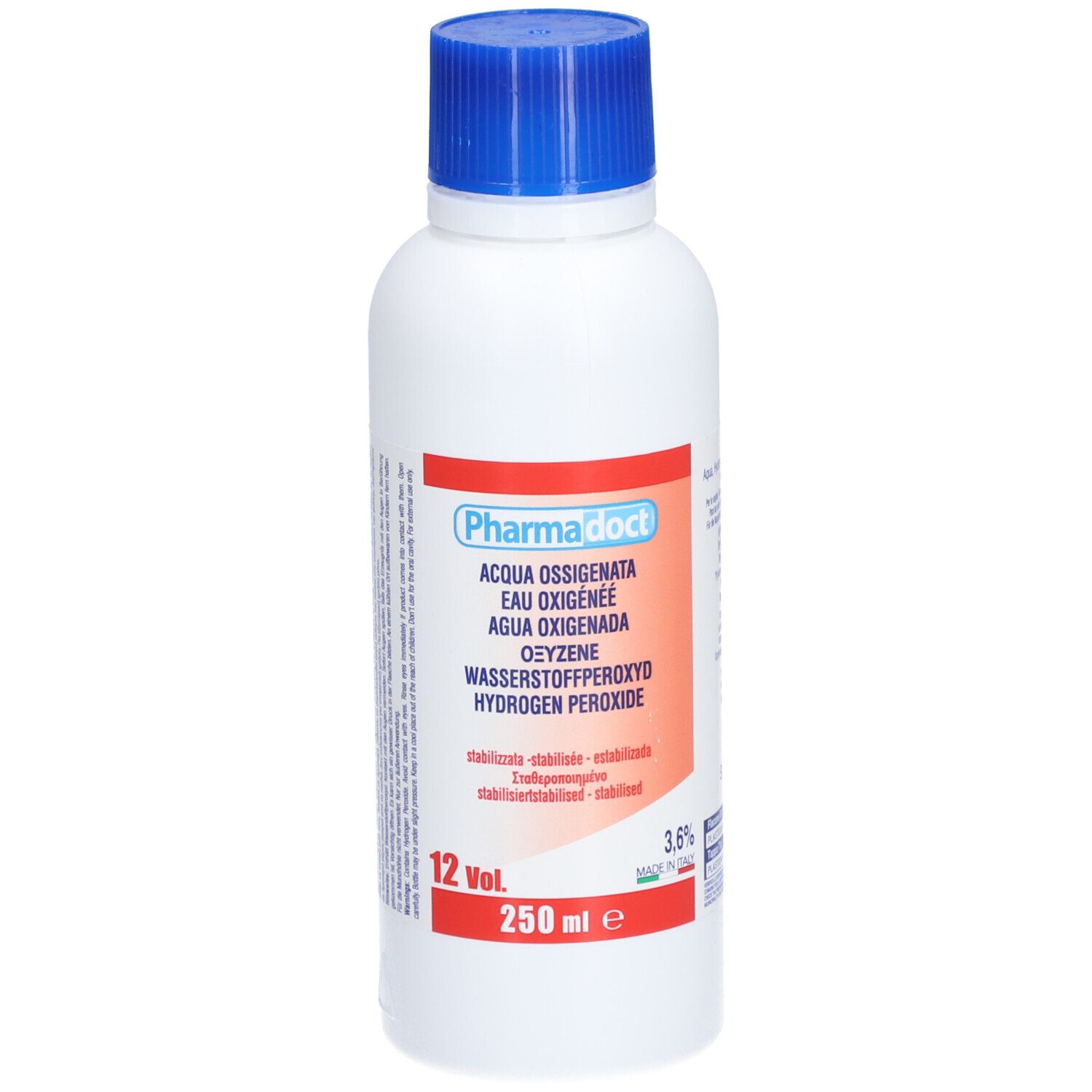 Witte fles met blauwe dop. Rood etiket met productnaam en meertalige aanduidingen. 250 ml.
