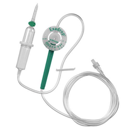 Dispositif de perfusion Exadrop avec chambre de goutte, pince à roulette et connecteur. Vert et transparent.